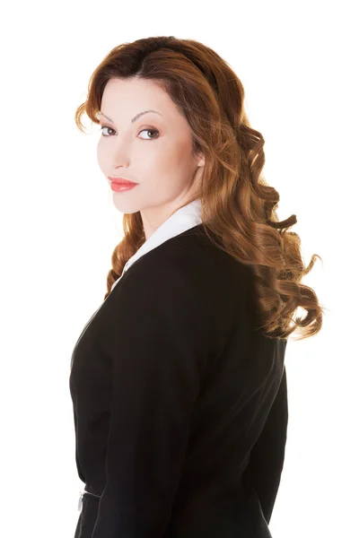 Side view of businesswoman looking at the camera — Stock Photo, Image