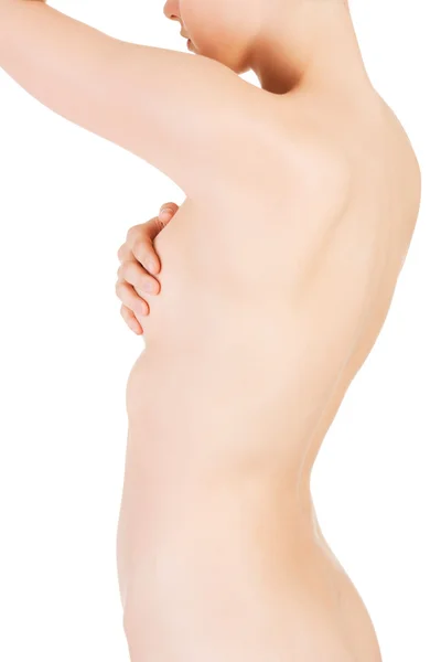 Närbild på naken kvinna röra vid hennes bröst — Stockfoto