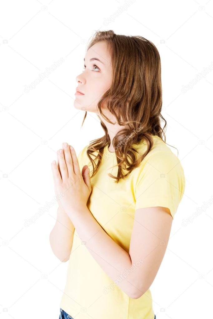 Side view of a woman praying