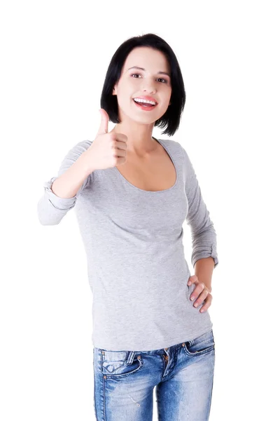 Vriendelijke vrouw gebaren duimschroef opwaarts — Stockfoto
