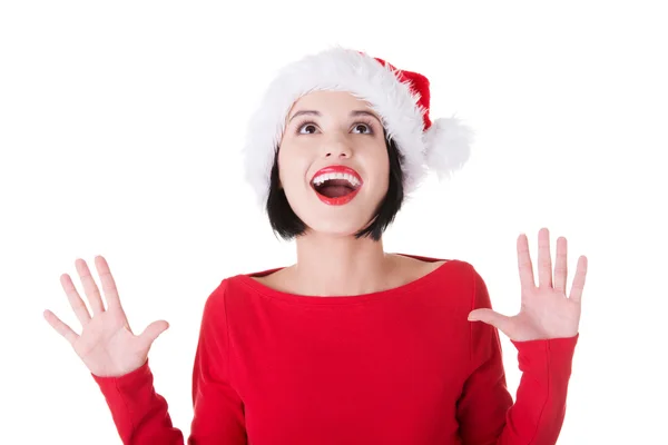 Porträt einer überraschten Frau in Weihnachtsmannkleidung — Stockfoto