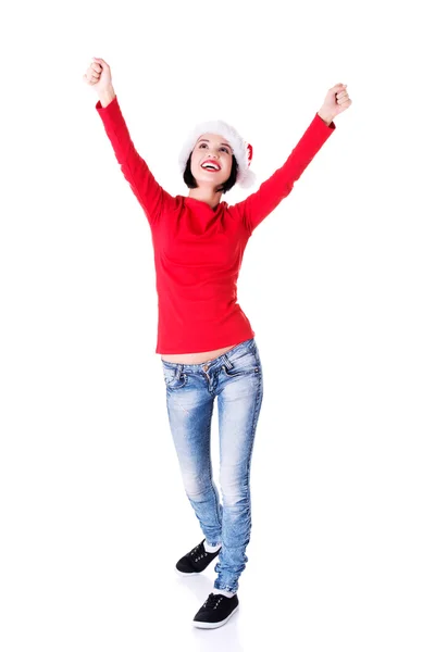 Woman wearing santa clothes in a winner gesture — Stock Photo, Image