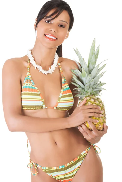 Happy woman in swimwear holding a pineapple — Stock Photo, Image