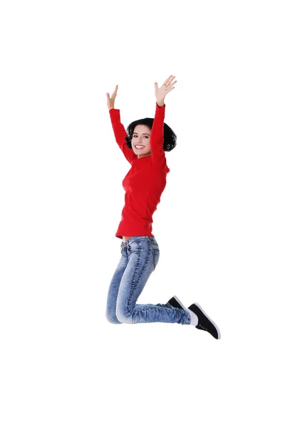 Full length cheerful woman jumping — Stock Photo, Image