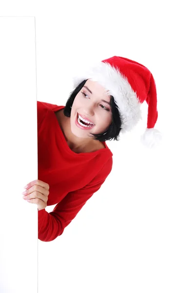 Donna in abiti da Babbo Natale con banner bianco vuoto — Foto Stock