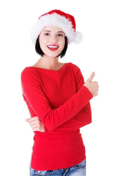 Woman in santa clothes gesturing thumbs up Royalty Free Stock Images
