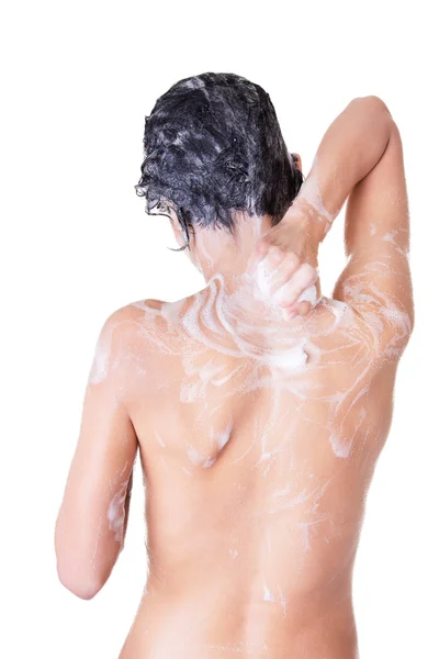 Back view of young sexy woman with soap foam Stock Photo