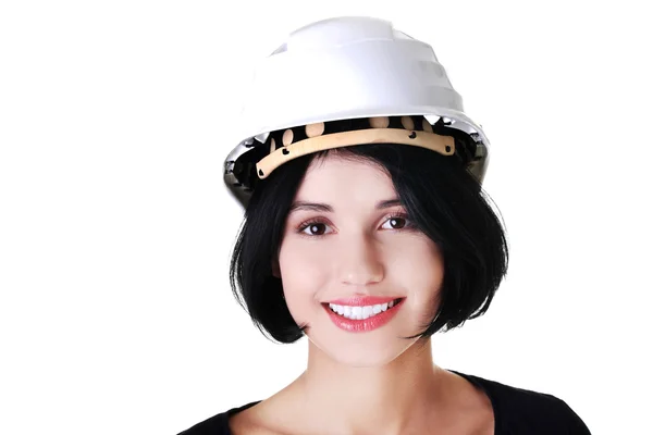 Portrait of a woman with hardhat looking at camera — Stock Photo, Image