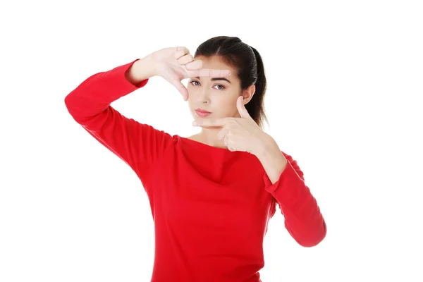 Happy woman creating frame with fingers — Stock Photo, Image