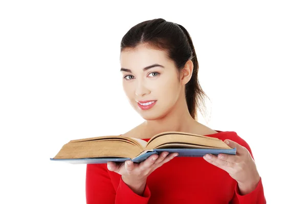 Portrait of student woman holding an open book — Stock Photo, Image