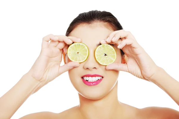 Portrait of nude woman with lemon on eyes — Stock Photo, Image