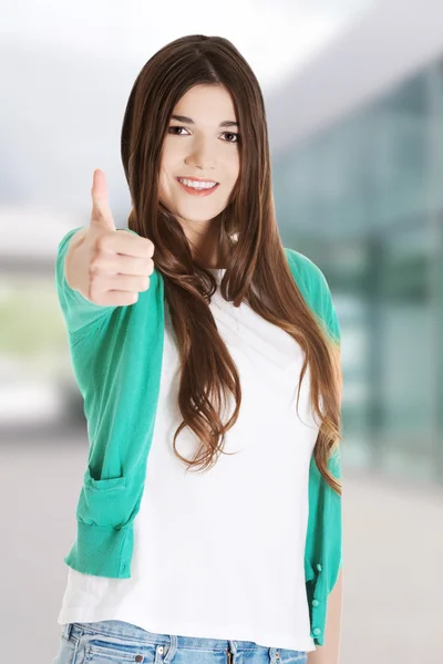 Adolescente menina gestos polegares para cima — Fotografia de Stock