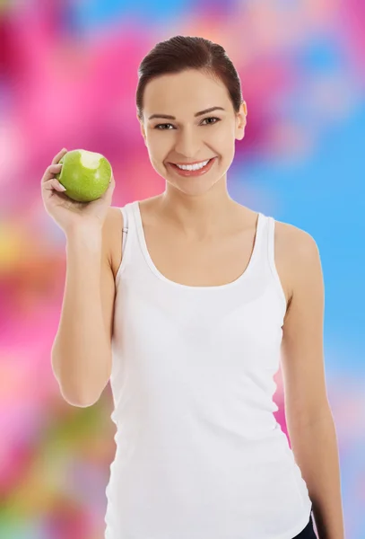 Woman holding an apple — Stock Photo, Image