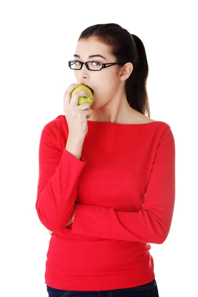 Portrait of beautiful woman eating an apple Stock Picture