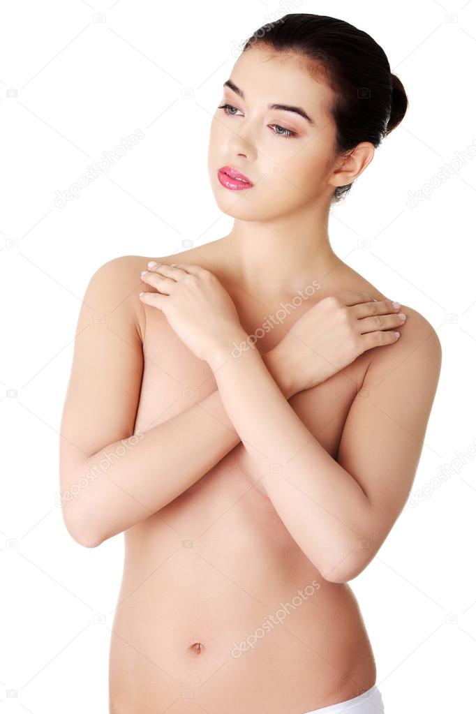 Sensual portrait of a nude woman with arms crossed