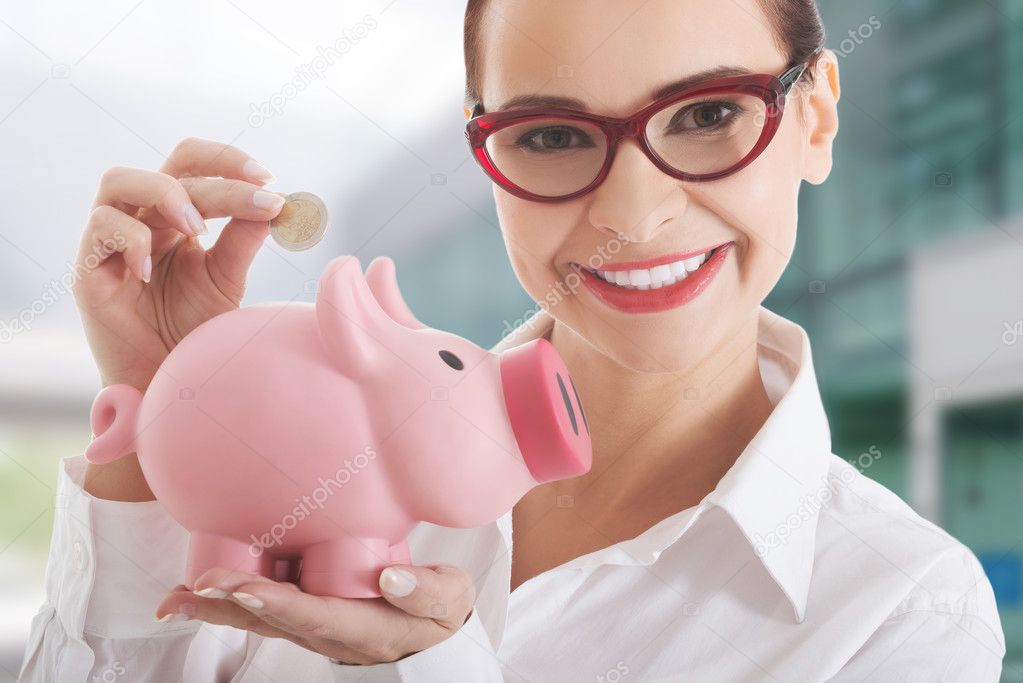 Business woman with piggy-bank