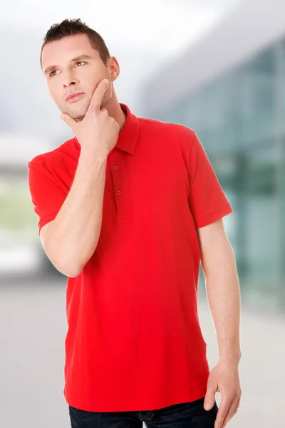 Bonito jovem pensativo homem — Fotografia de Stock