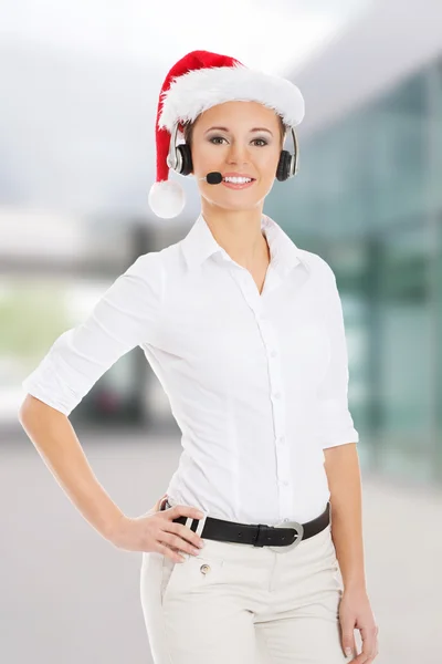 Young business woman in santa hat — Stock Photo, Image