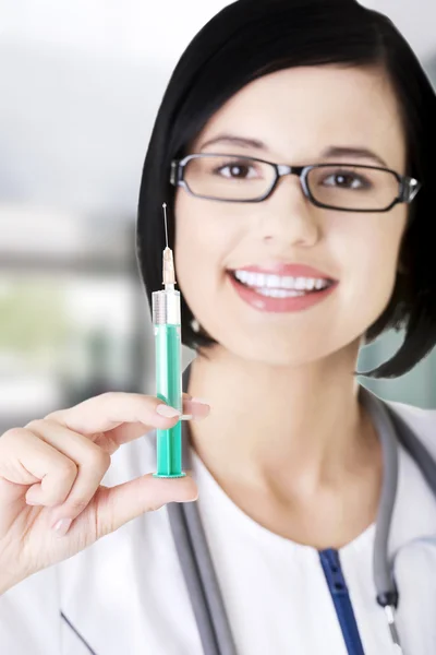 Female doctor holding a syringe — Stock Photo, Image
