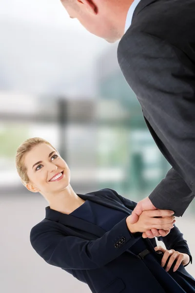 Business couple shaking hands — Stock Photo, Image