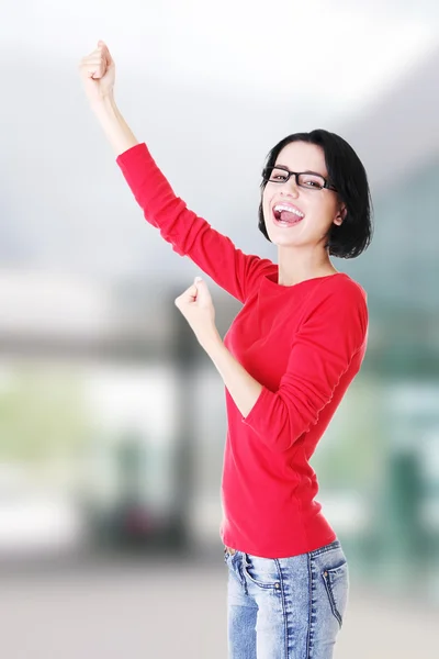 Excited woman with fists up