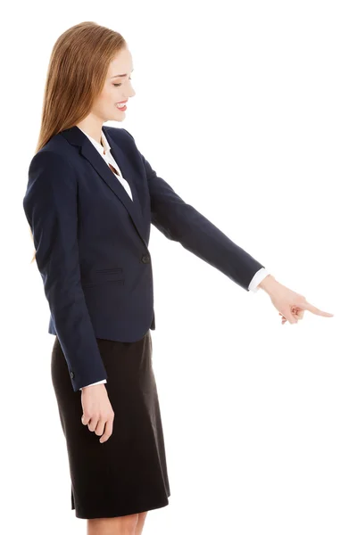 Businesswoman pointing on something — Stock Photo, Image