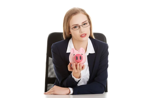 Businesswoman holding a piggybank — Stock Photo, Image