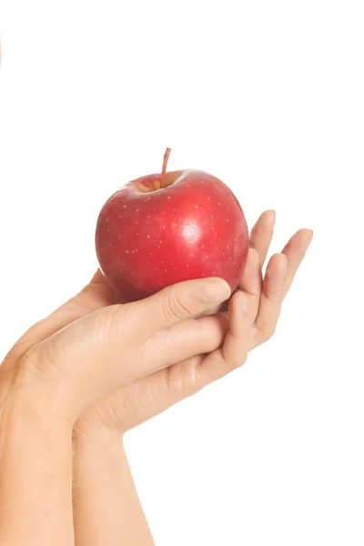 Ruka drží jablko — Stock fotografie