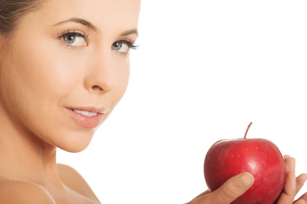 Beautiful woman holding an apple — Stock Photo, Image