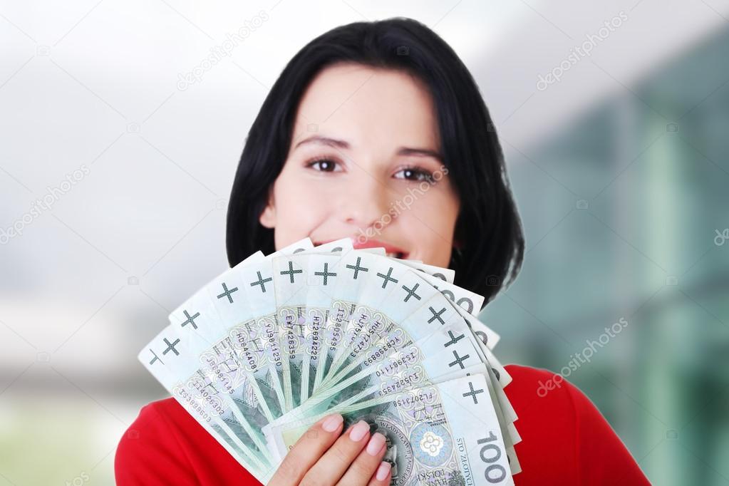 Woman holding money clip