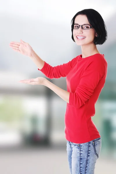 Happy , excited woman presenting copy space — Stock Photo, Image
