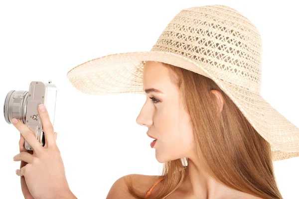 Portrait of a woman in hat taking photos — Stock Photo, Image