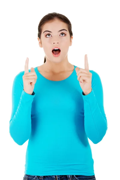 Full length woman pointing up — Stock Photo, Image