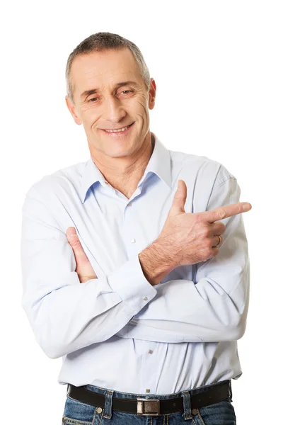 Handsome man pointing to the right — Stock Photo, Image