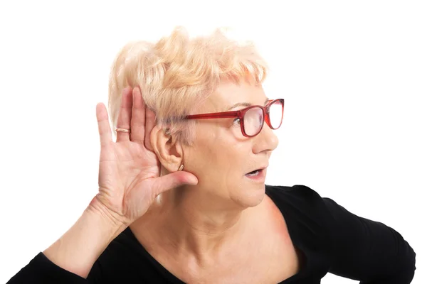 Old woman overhearing someone — Stock Photo, Image