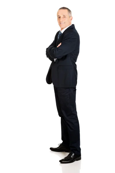 Full length side view businessman with folded arms — Stock Photo, Image