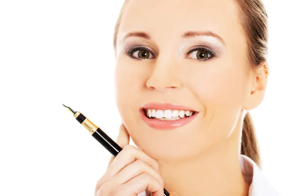 Businesswoman holding a pen — Stock Photo, Image