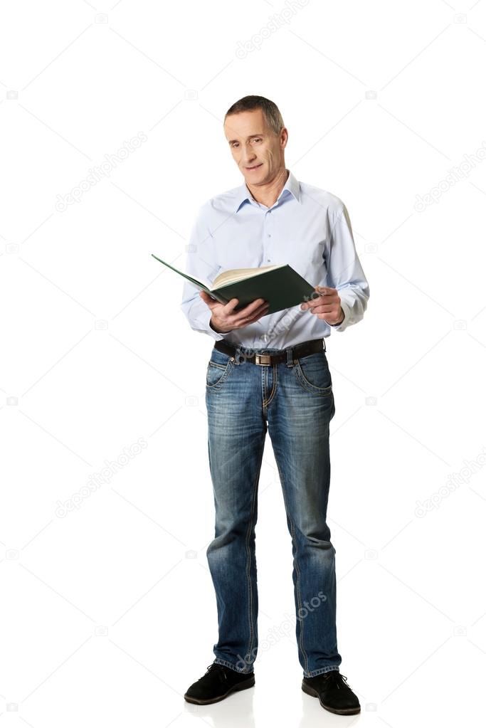 Handsome man reading his schedule