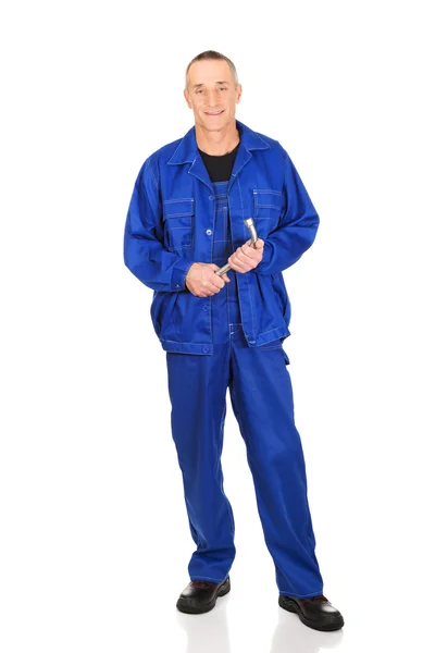 Repairman holding his wrench — Stock Photo, Image