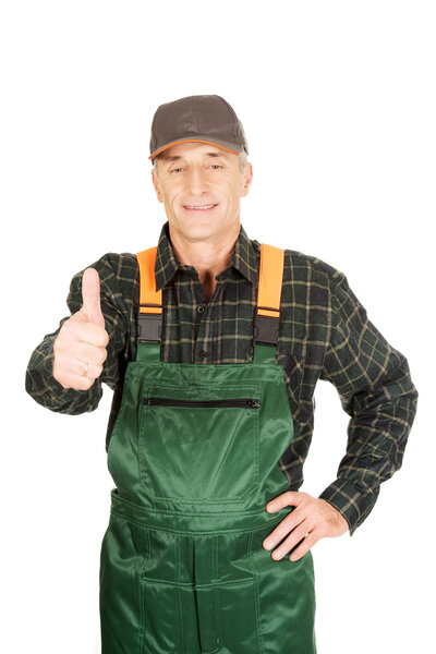 Mature gardener with thumb up