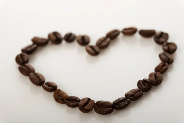 Coffee beans in shape of heart — Stock Photo, Image