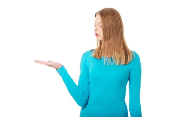 Woman presenting something on palm — Stock Photo, Image