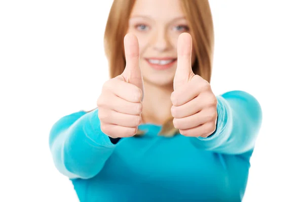 Woman showing thumbs up sign — Stock Photo, Image