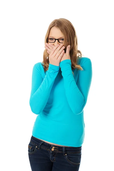 Teenager covering her mouth — Stock Photo, Image