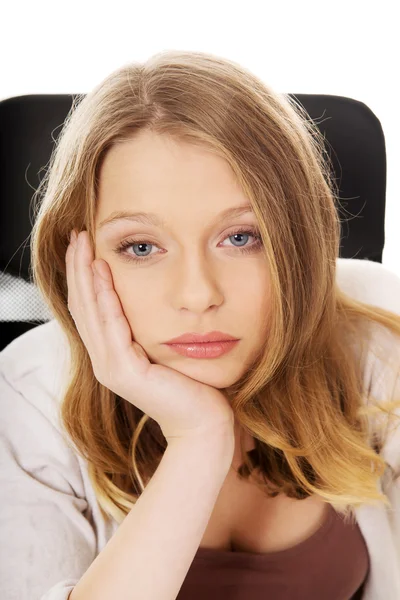 Worried woman sitting at the desk — Stock Photo, Image