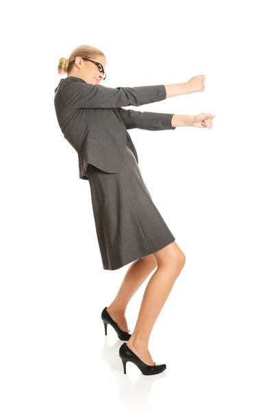Businesswoman pulling a stick — Stock Photo, Image