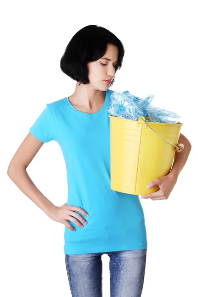 Pensive woman with plastic rubbish — Stock Photo, Image