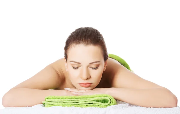 Girl on a stone therapy, hot stone massage — Stock Photo, Image