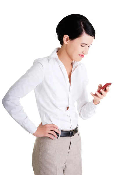 Affärskvinna med mobiltelefonen — Stockfoto