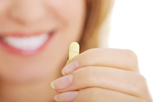 Woman with pill — Stock Photo, Image